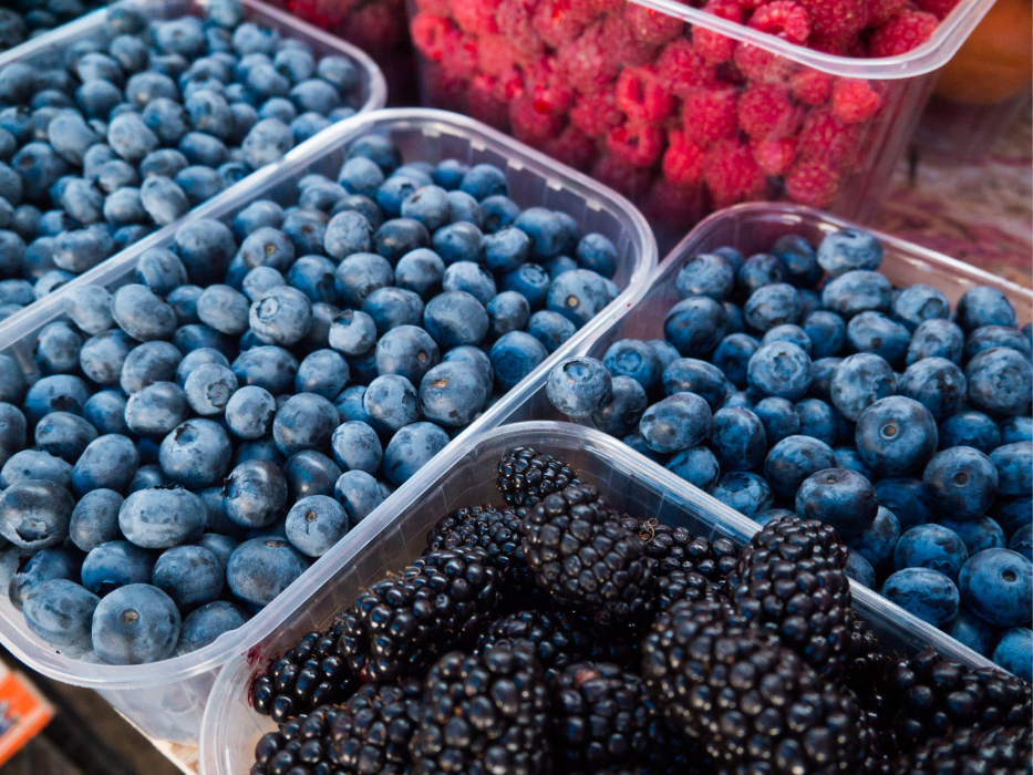 baskets of blueberries blackberries raspberries in containers
