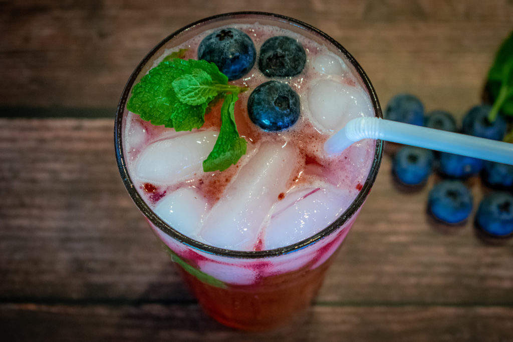 top down view of a blueberry mojito with mint